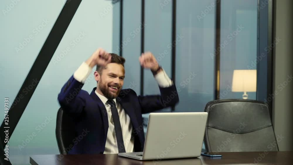 The young director is happy about the success of his company. The young director is happy about the success of his company.