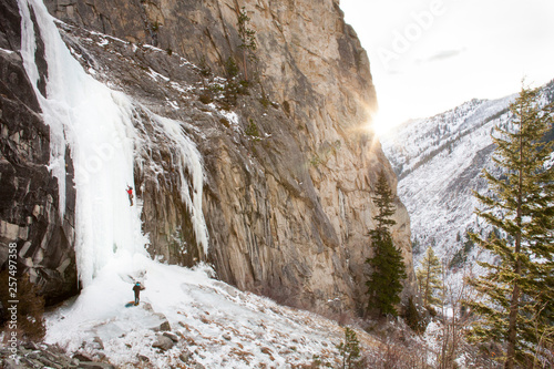 People ice climbing on frozen Blodgett Falls  photo