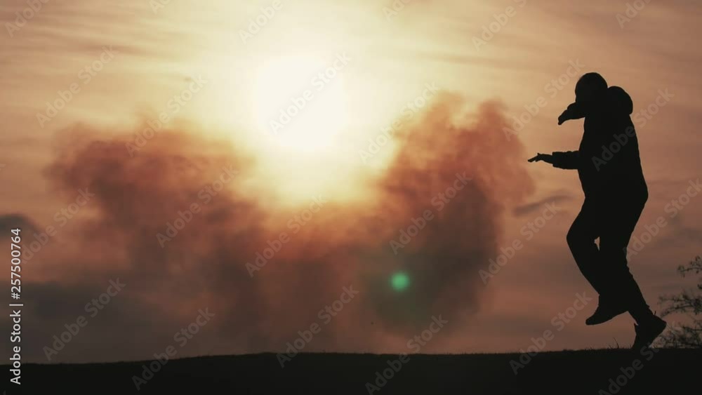 Jolly man keeping hands aside, running and jumping at a cloudy sunset in slo-mo Jolly man keeping hands aside, running and jumping at a cloudy sunset in slo-mo