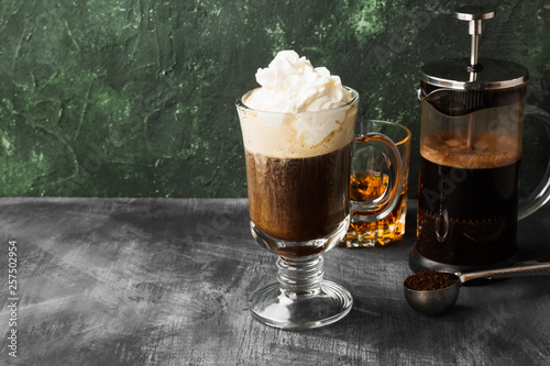 Irish coffee with whisky on dark background. Copy space. Food background
