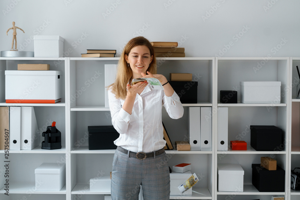 young businesslady in office make good bargain have big profit fling money young businesslady in office make good bargain have big profit fling money