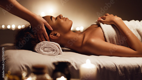 Slika na platnu Girl having massage and enjoying aroma therapy in spa