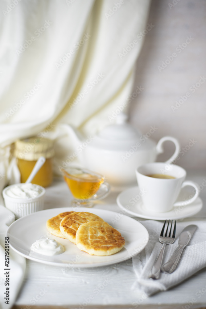 Cheesecakes serving for breakfast on a white table