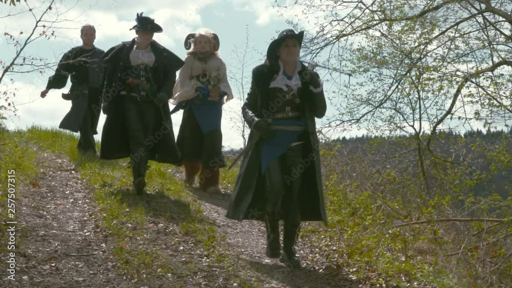 Fantasy Group of Adventurers walking into forest Fantasy Group of Adventurers walking into forest