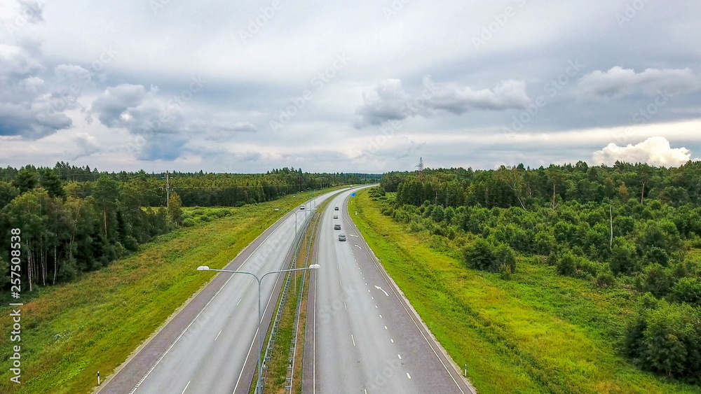 11059_Aerial_shot_of_the_roads_with_the_forest_on_the_side.jpg