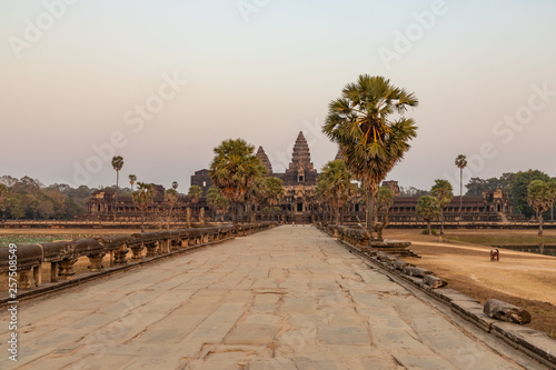 On the ancient stone road to Angkor Wat after sunset. Siem Reap, Cambodia