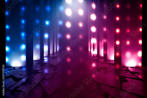 Dark empty stage  multicolored rays of neon searchlight  wet asphalt  smoke  night shooting  bokeh color.