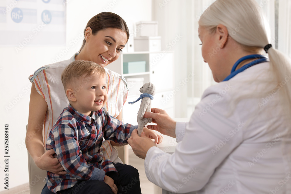 Mother with child visiting doctor in hospital Mother with child visiting doctor in hospital