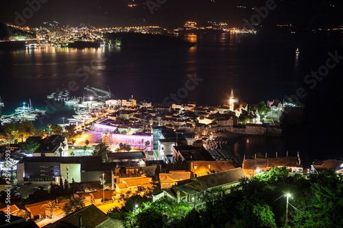 The Budva city - the modern part is among the mountain ranges. Panorama of the Budva Riviera at night. Montenegro, Europe © Kekyalyaynen