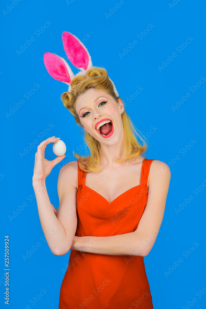 Easter. Rabbit. Bunny. Egg hunt. Spring. Holiday. Happy girl with rabbit ears holds white eggs. Easter concept. Woman with bunny ears. White eggs. Bunny girl. Easter. Rabbit. Bunny. Egg hunt. Spring. Holiday. Happy girl with rabbit ears holds white eggs. Easter concept. Woman with bunny ears. White eggs. Bunny girl.