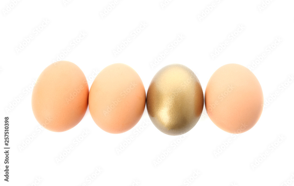 One golden egg among others on white background, top view One golden egg among others on white background, top view