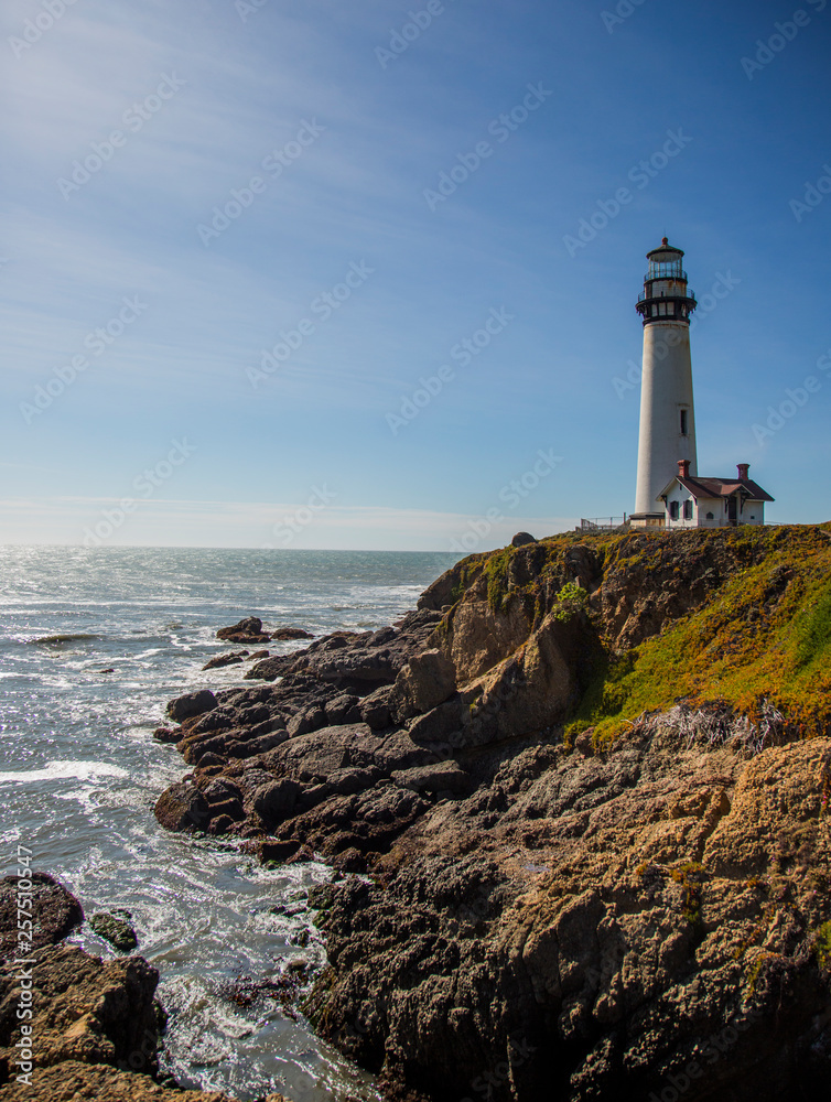 The Pigeon Point Lighthouse near Pescadero, California on a sunny day. The Pigeon Point Lighthouse near Pescadero, California on a sunny day.