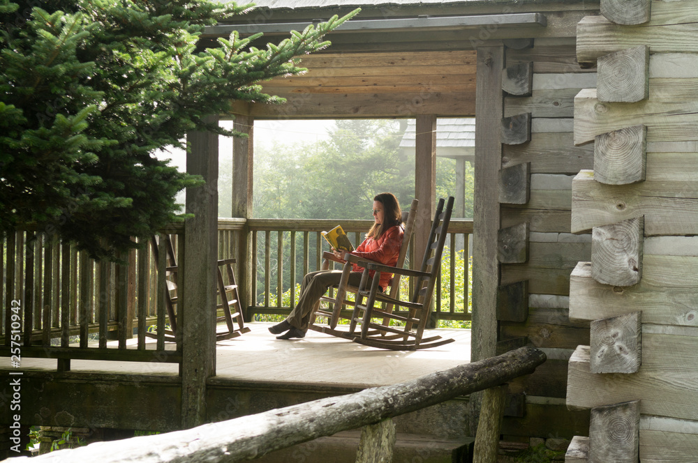 A woman reading at the Leconte Lodge, Great Smoky Mountain National Park, Gatlinburg, Tennesee. A woman reading at the Leconte Lodge, Great Smoky Mountain National Park, Gatlinburg, Tennesee.