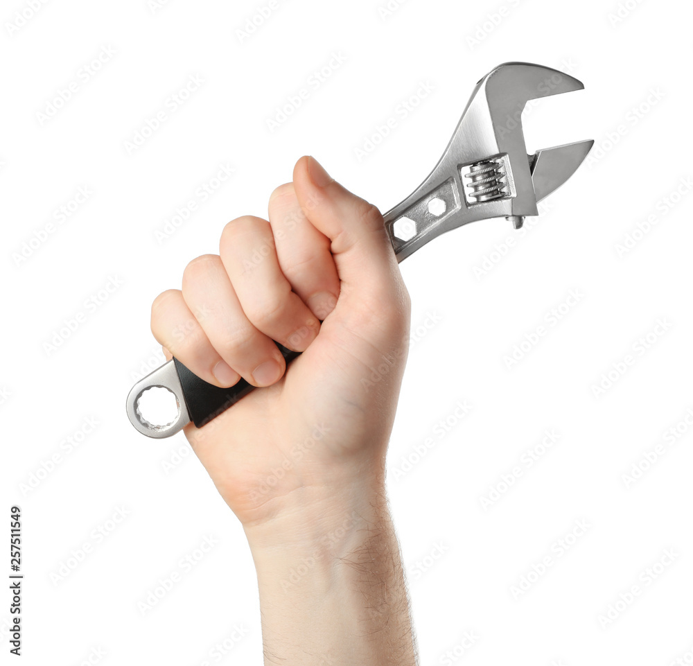 Man holding adjustable wrench isolated on white, closeup. Plumbing tools Man holding adjustable wrench isolated on white, closeup. Plumbing tools