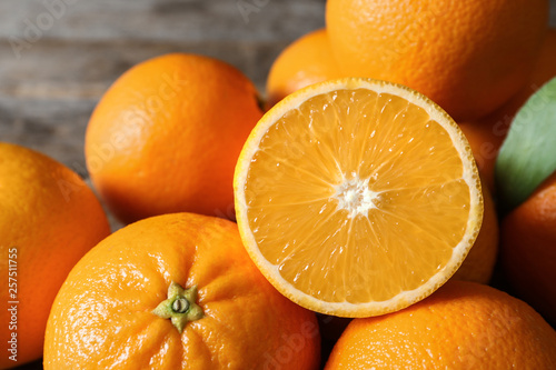 Fresh oranges on blurred background, closeup. Healthy fruits