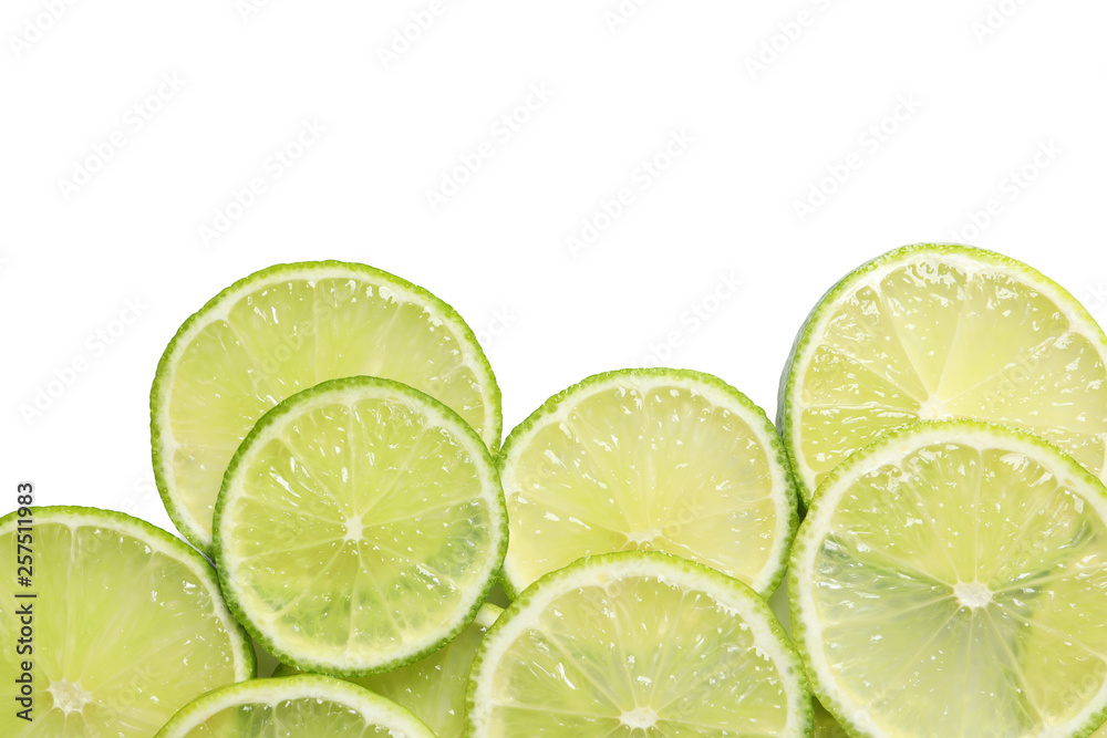 Juicy lime slices on white background, top view. Citrus fruit Juicy lime slices on white background, top view. Citrus fruit