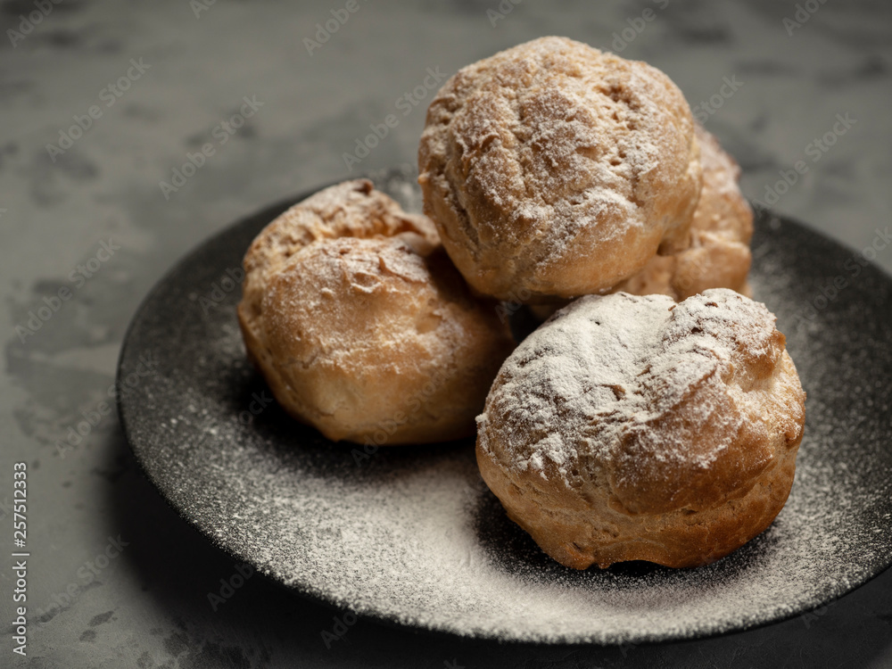 Delicious tender profiteroles with cream Delicious tender profiteroles with cream