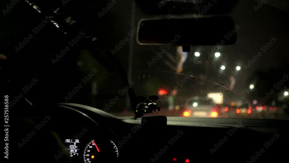 wipers clean the rain from the windshield. The driver goes around the city by car wipers clean the rain from the windshield. The driver goes around the city by car