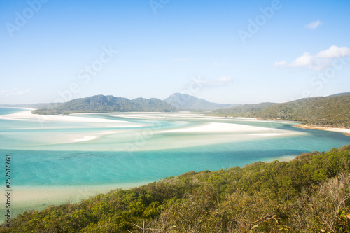 view over whitsunday island beach with blue sunny sky and white sand at whiteheaven beach, australia east coast
