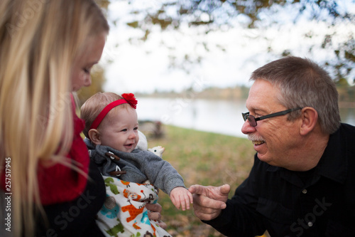 A grandfather talks to his youngest grandchild. photo