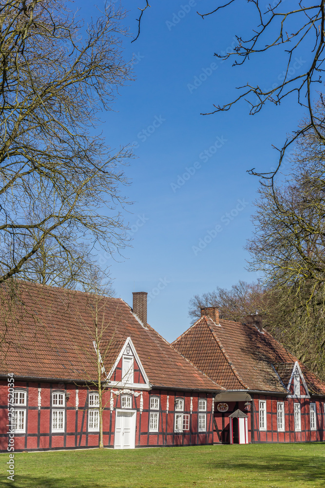 Red half timbered houses in the castle park in Rheda, Germany Red half timbered houses in the castle park in Rheda, Germany