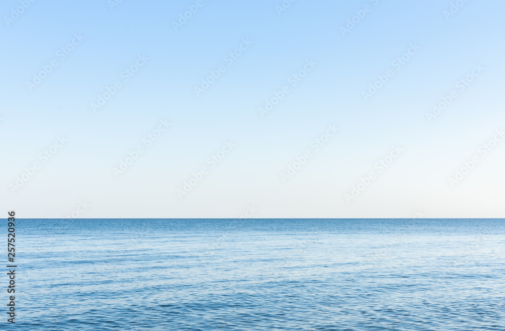 Obraz premium Sea background, quiet cozy calm cloudless morning on the sea coast