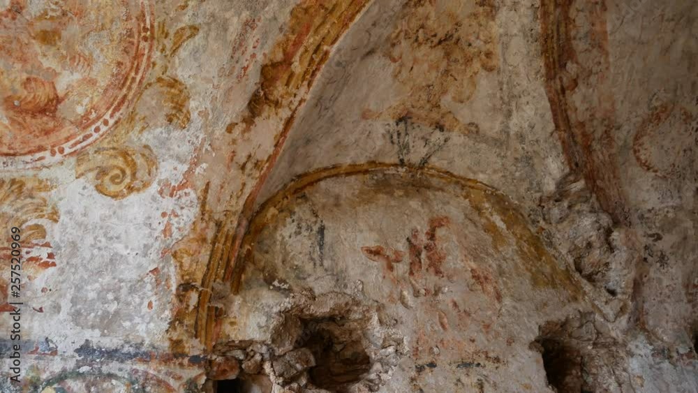 Apricena, Apulia, Italy - March 09 2019: ruins of Eremo of Sant'Agostino with traces of frescoes in the valley of the hermitages. Hermitages of Stignano in Gargano National Park