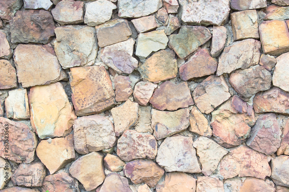 Seamless brown pattern of decorative grey slate stone wall surface of modern style design decorative uneven cracked realmasonry wall. Seamless brown pattern of decorative grey slate stone wall surface of modern style design decorative uneven cracked realmasonry wall.