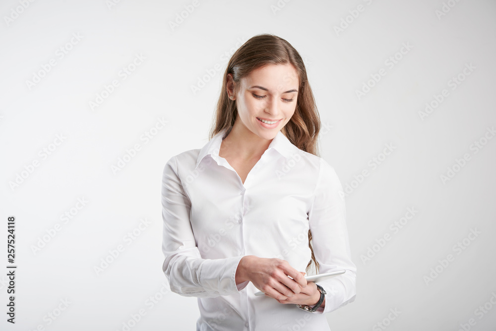 Young woman holding touchpad in her hand Young woman holding touchpad in her hand