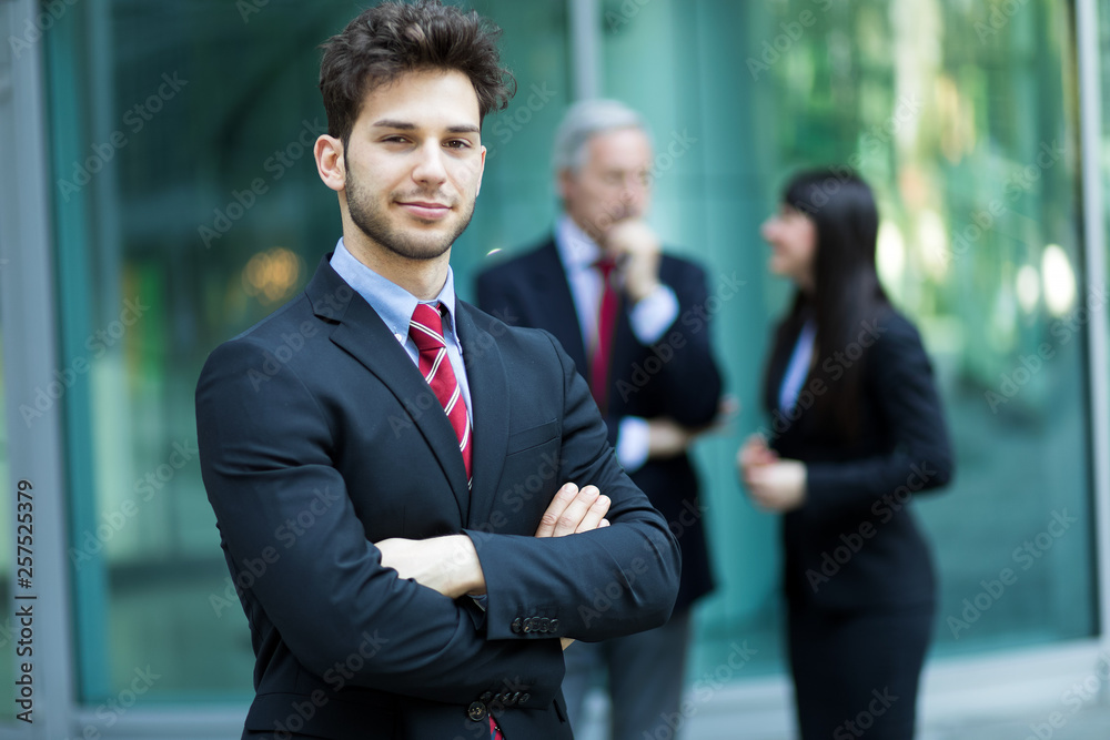Business team smiling outdoor in a modern urban setting Business team smiling outdoor in a modern urban setting