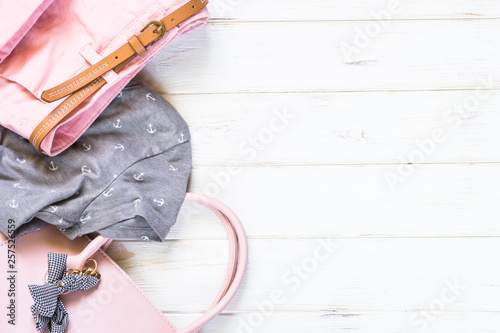 Woman clothes and accessories in pink and gray colors photo