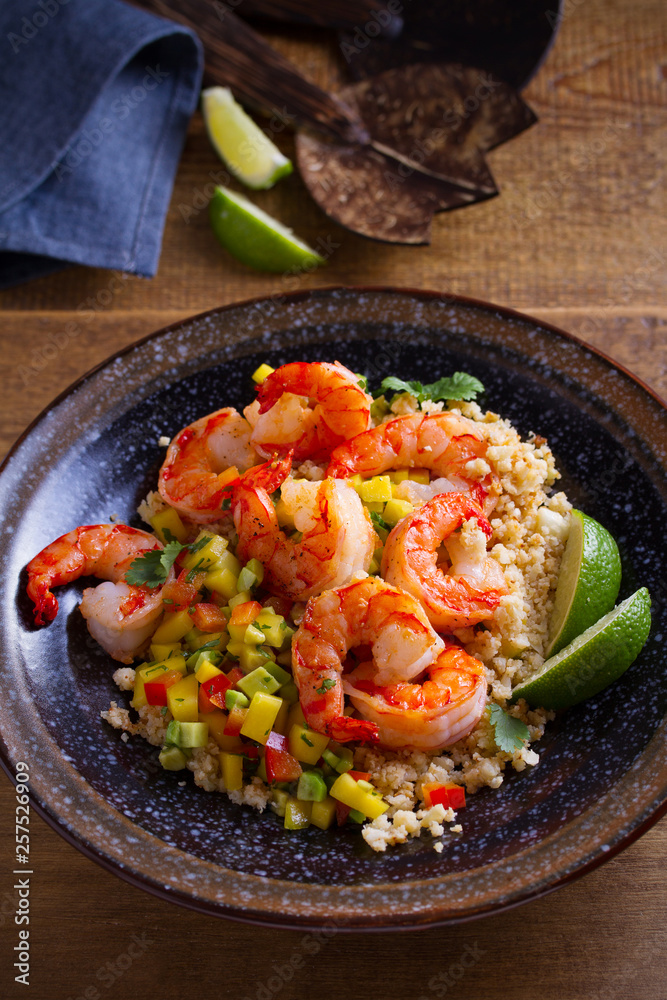 Shrimps with cauliflower, mango avocado, red paprika pepper and lime. vertical Shrimps with cauliflower, mango avocado, red paprika pepper and lime. vertical