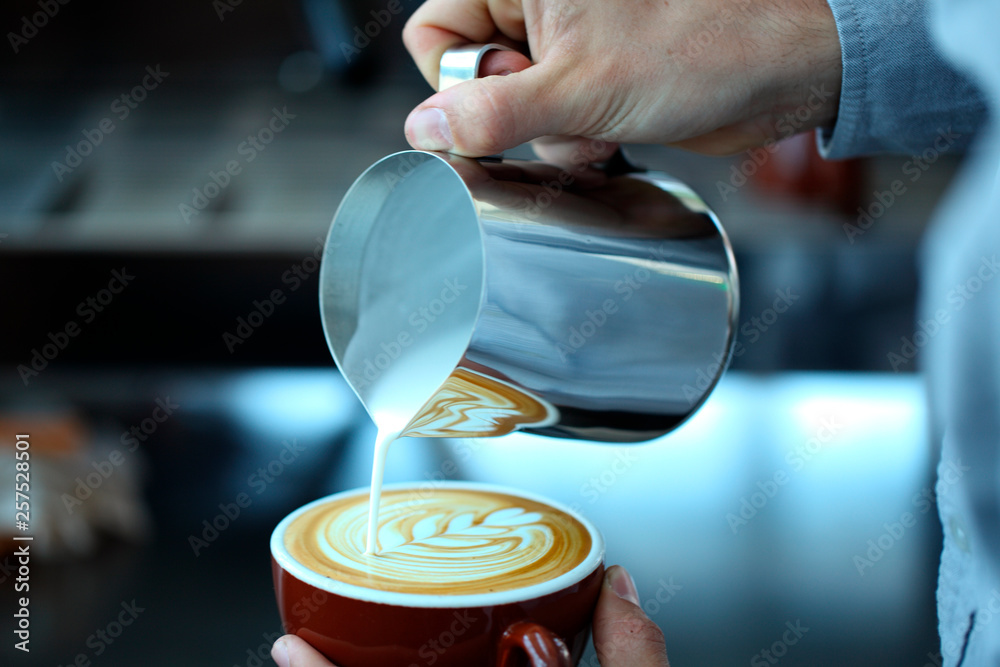 Pouring milk into cup, Oakland, USA Pouring milk into cup, Oakland, USA