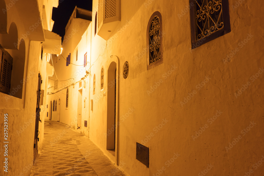 Fototapeta premium Illuminated Night streets of Asilah Medina, on Atlantic Coast in Morocco