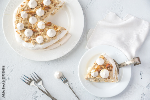 Pavlova cake with caramel and almonds