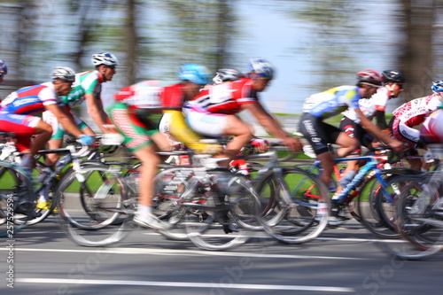 MOSCOW, RUSSIA - 6 May 2002: Cycling marathon, along city streets, blurred motion closeup on red and white