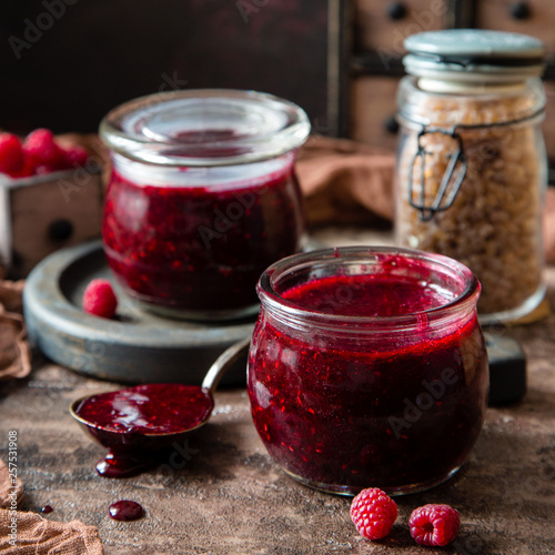 Two glass jars with homemade dark red jam