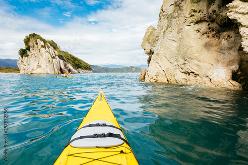 Point of view of person kayaking beside Abel Tasman National Park cliffs photo