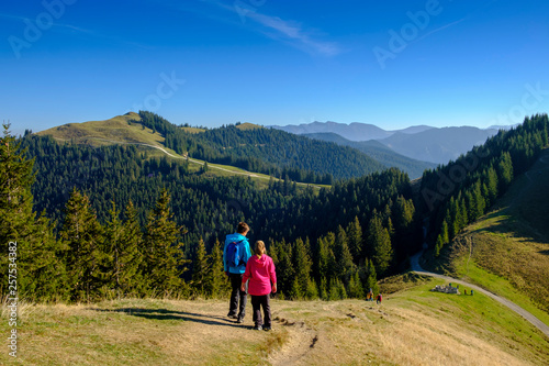 Germany, Bavaria, Hoernle near Bad Kohlgrub, young couple on a hiking trip in alpine landscape photo