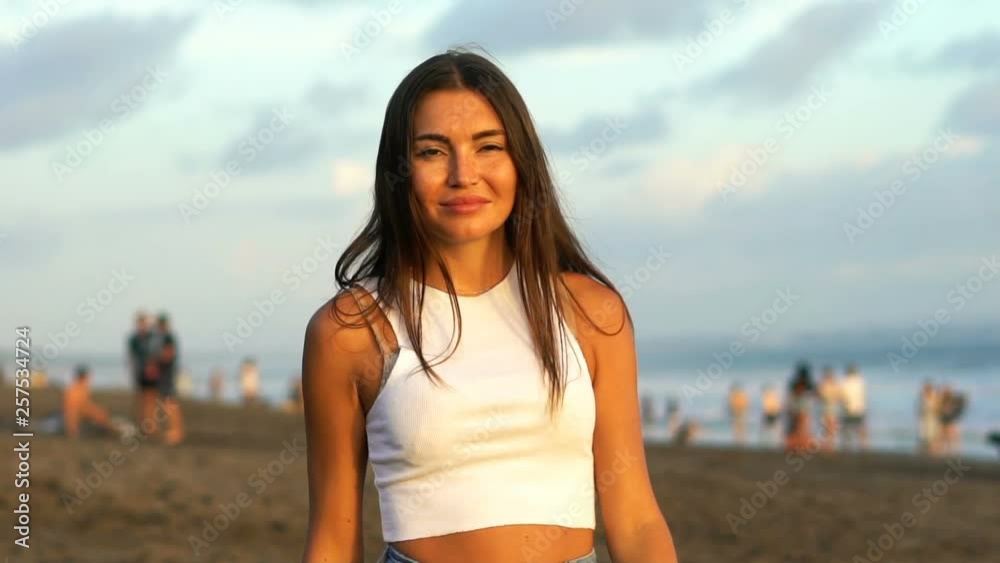 Happy woman walking on exotic beach, super slow motion Happy woman walking on exotic beach, super slow motion