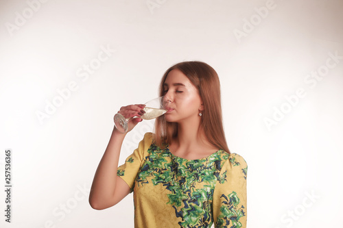 The portrait of an young blonde lady isolated over a white background