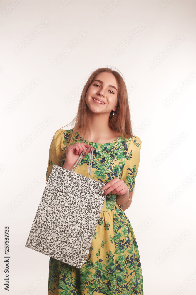 The portrait of an young blonde lady isolated over a white background The portrait of an young blonde lady isolated over a white background