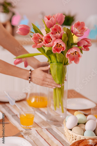 Young female person laying the table with love