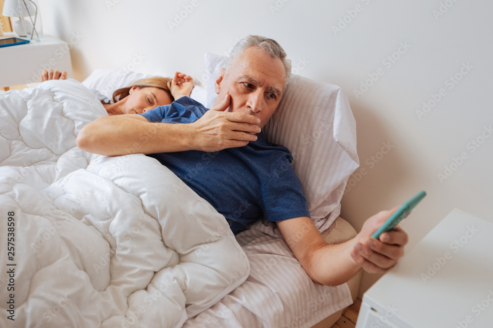 Dark-haired husband after seeing disturbing message from son Dark-haired husband after seeing disturbing message from son