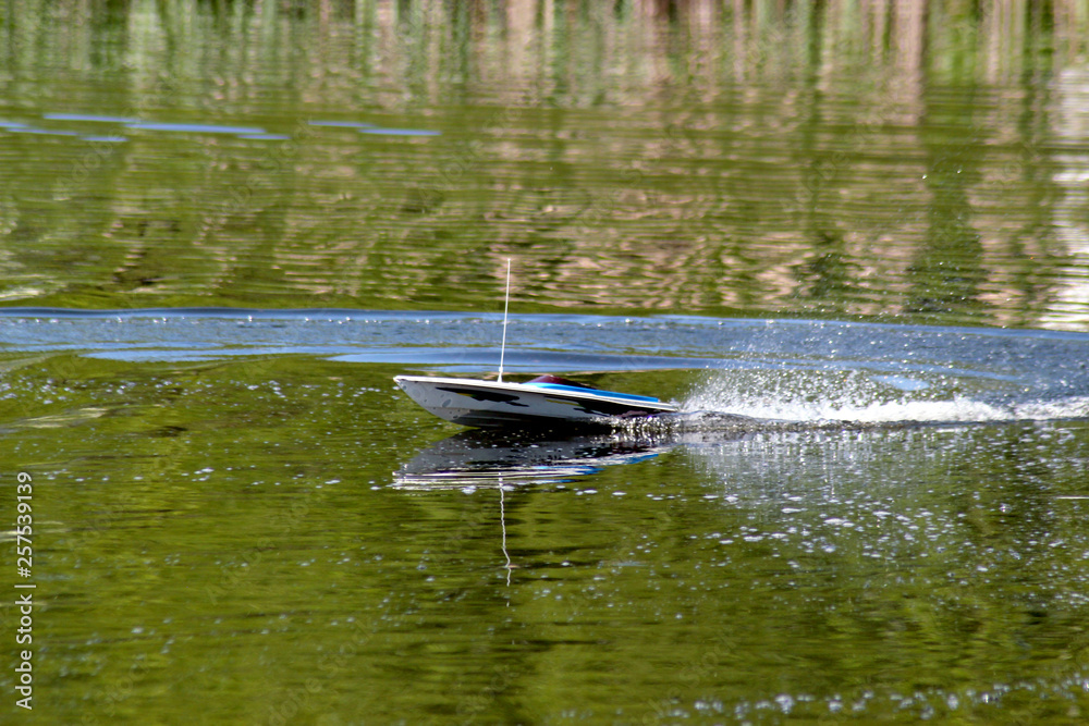 Boat model in motion on the water Boat model in motion on the water
