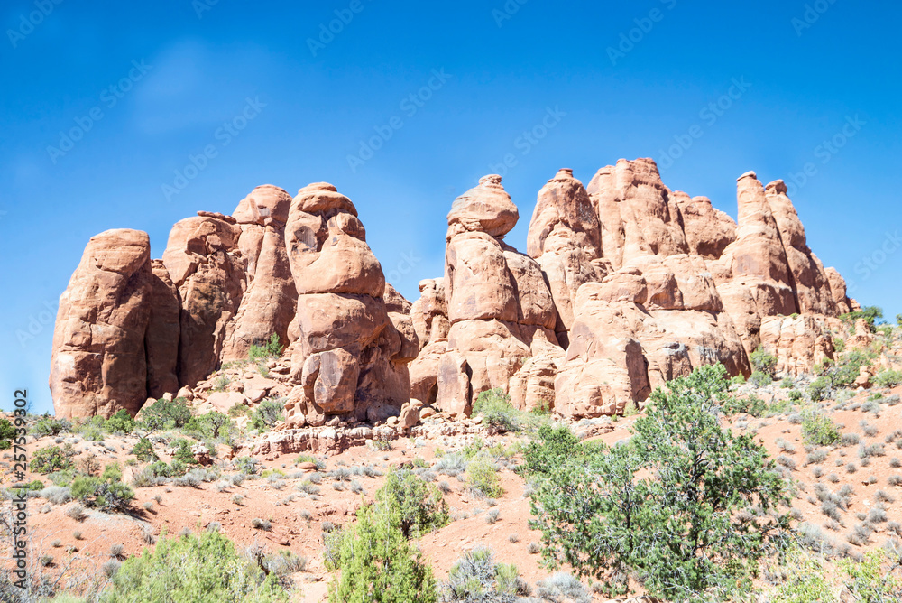 Extreme spires rise out of the landscape in Utah desert.