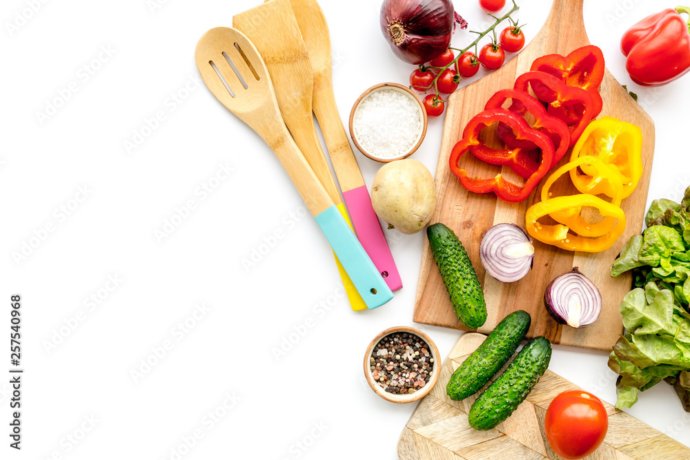 Vegan food cooking with raw vegetables on white background top view mock up Vegan food cooking with raw vegetables on white background top view mock up