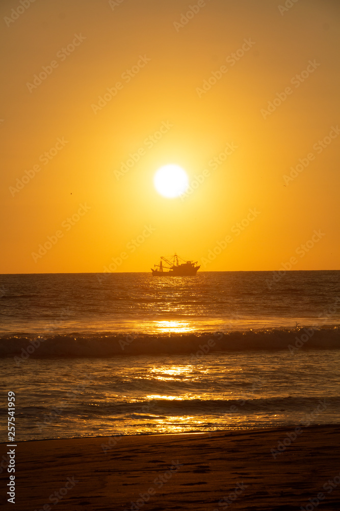 Boat floting at sunset 