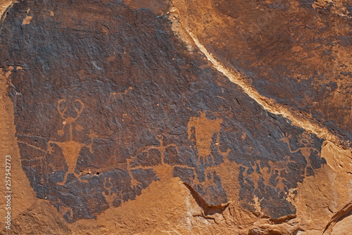 Rock Art scenes carved by the ancients on boulders in Utah.
