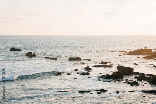 Rocks and waves in the Pacific Ocean at sunset, in Laguna Beach, Orange County, California